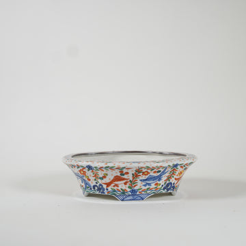 Bowl with design of fishweed in overglaze enamels